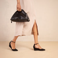 Landmark Space black suede wedge that looks like a heel and feels like a sneaker